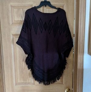 Purple and black frilled poncho sweater